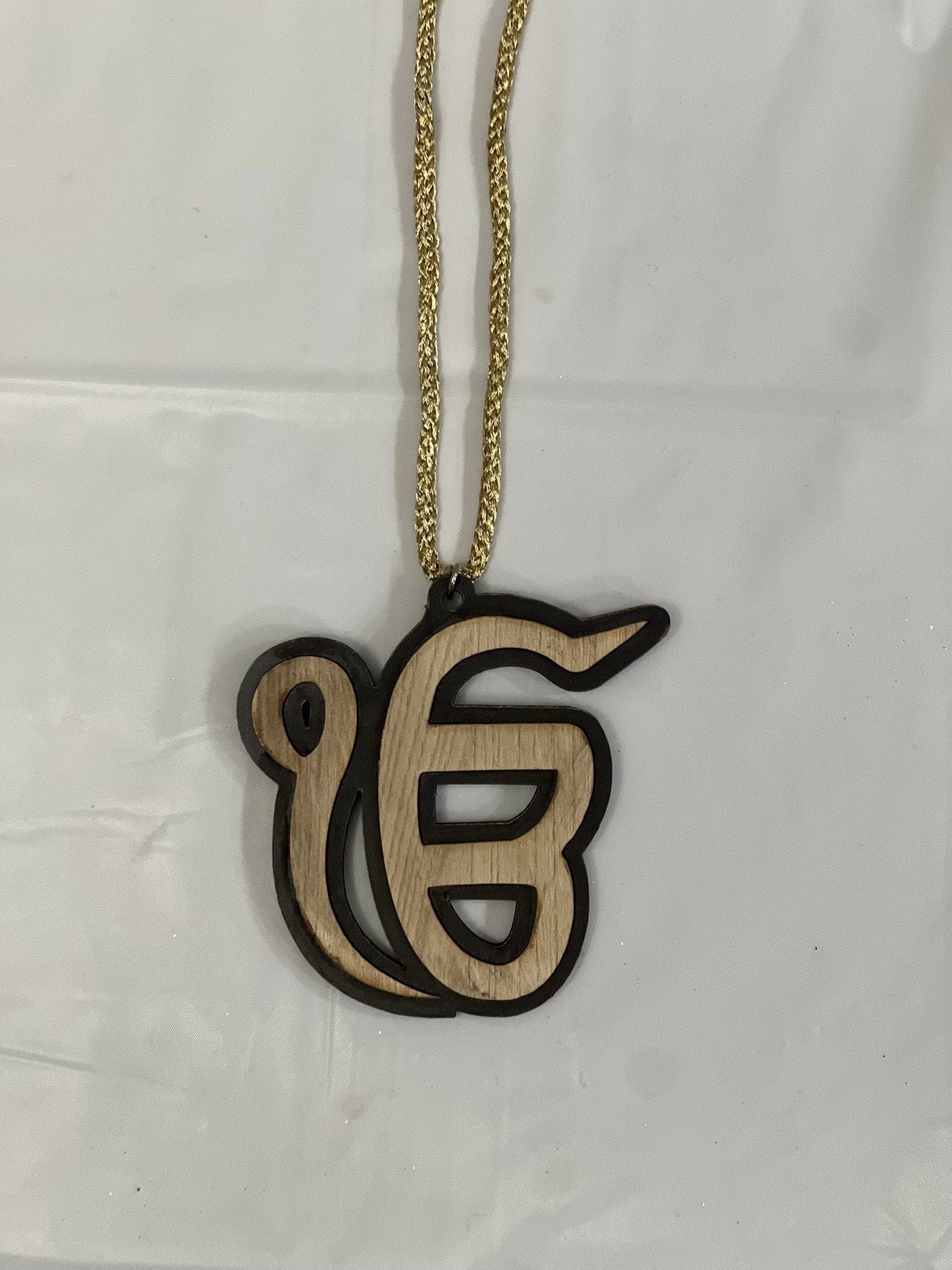 il_fullxfull.5749830362_oll5.jpg Sikh Car Hanging: Punjabi Wooden Auto Ornament - Image 1